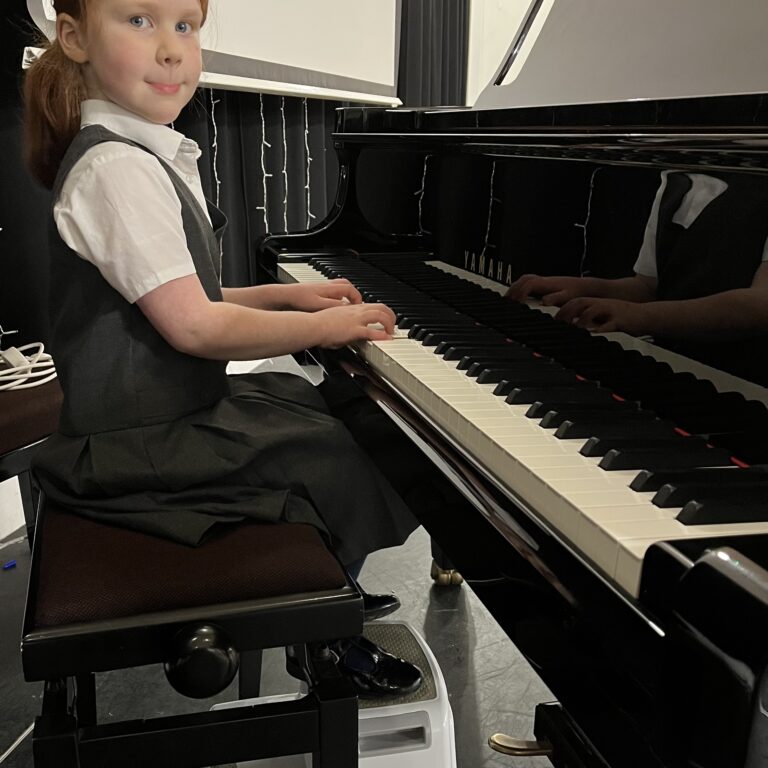 girl playing the piano