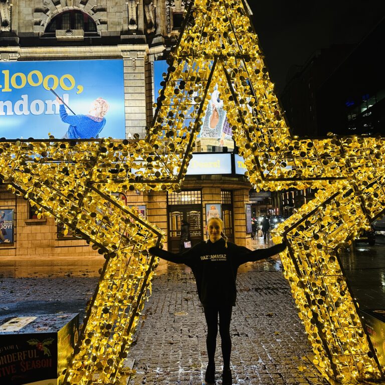 Student stood behind a star display