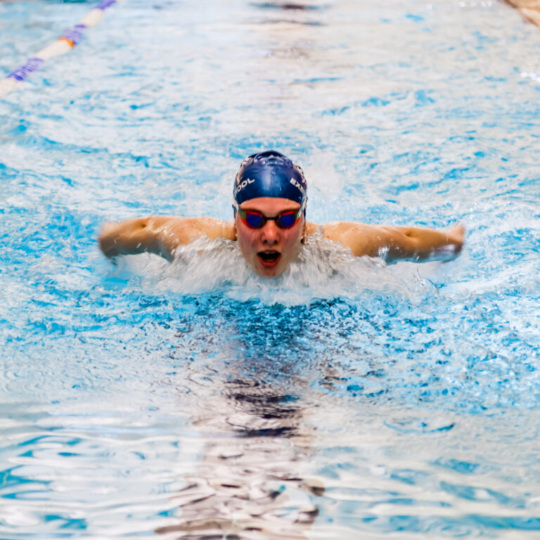 student emerging out of water