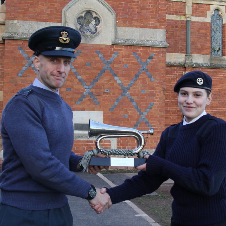 man giving student an award