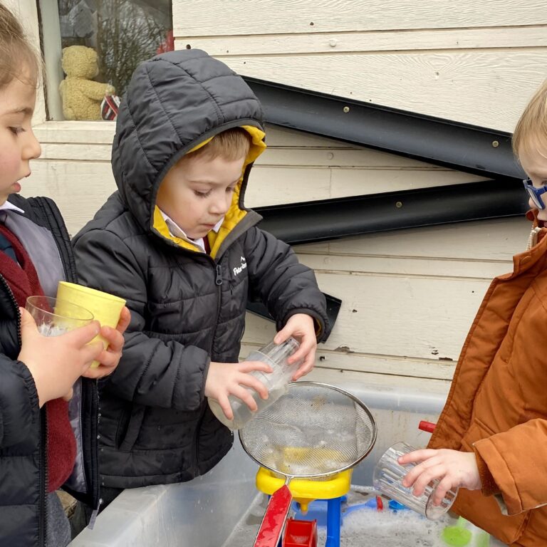 pre prep students playing with water