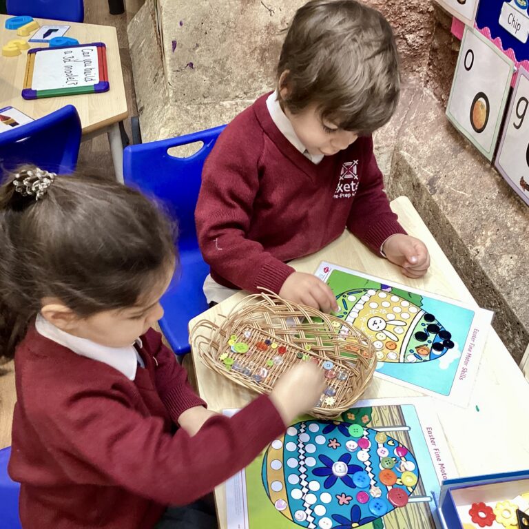 students collecting buttons to stick onto their easter eggs