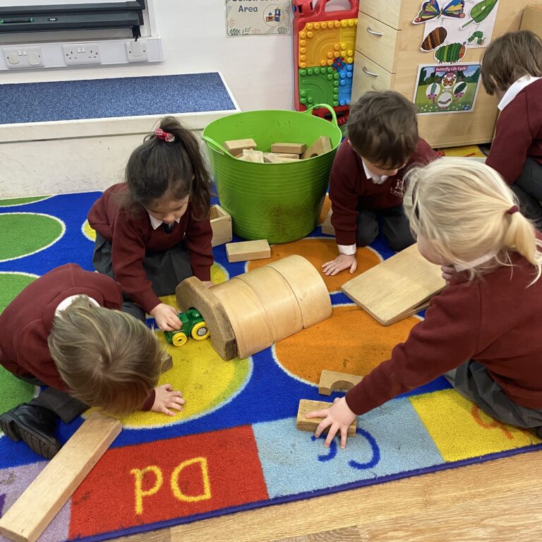 students playing on a mat