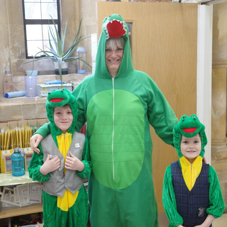 students and teacher dressed up as crocodiles