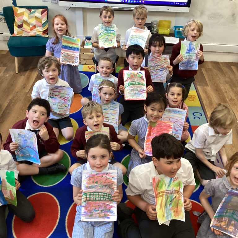 students holding their colouring