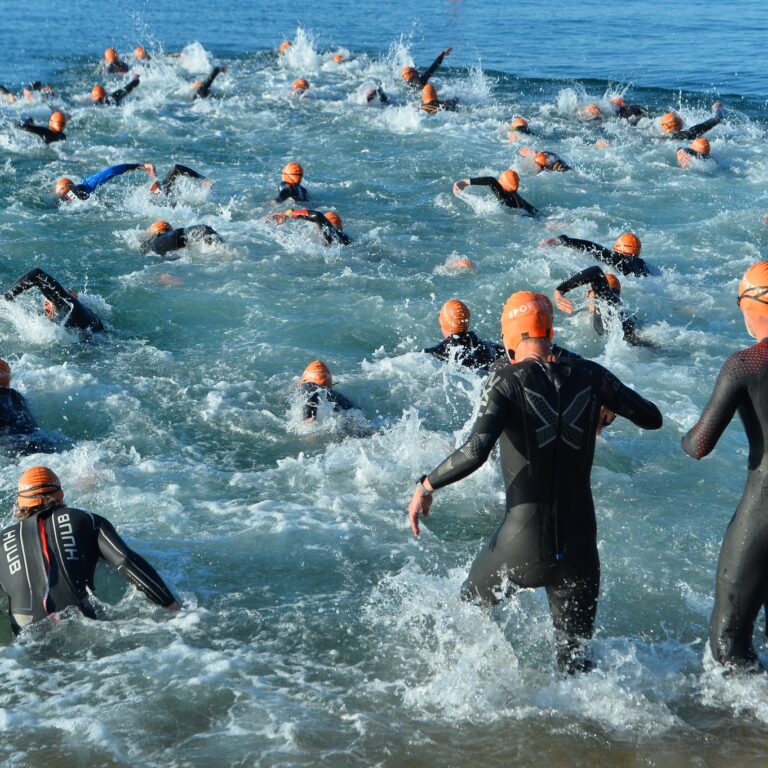 lots of swimmers making their way into the sea