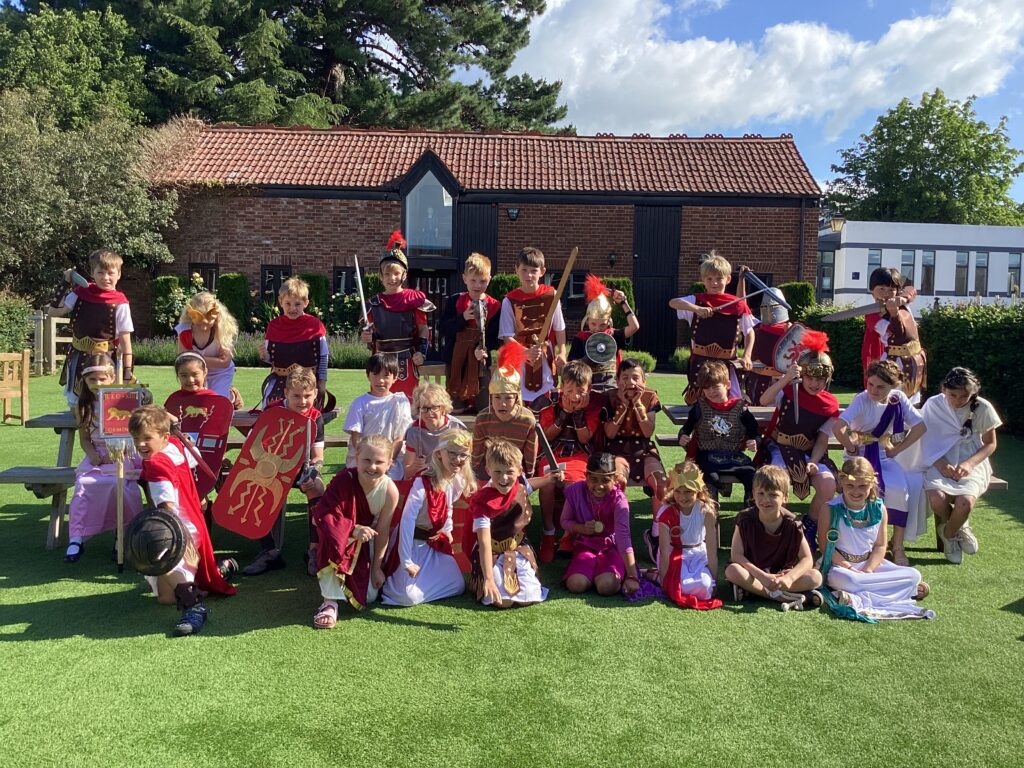 group of children dressed up for roman day