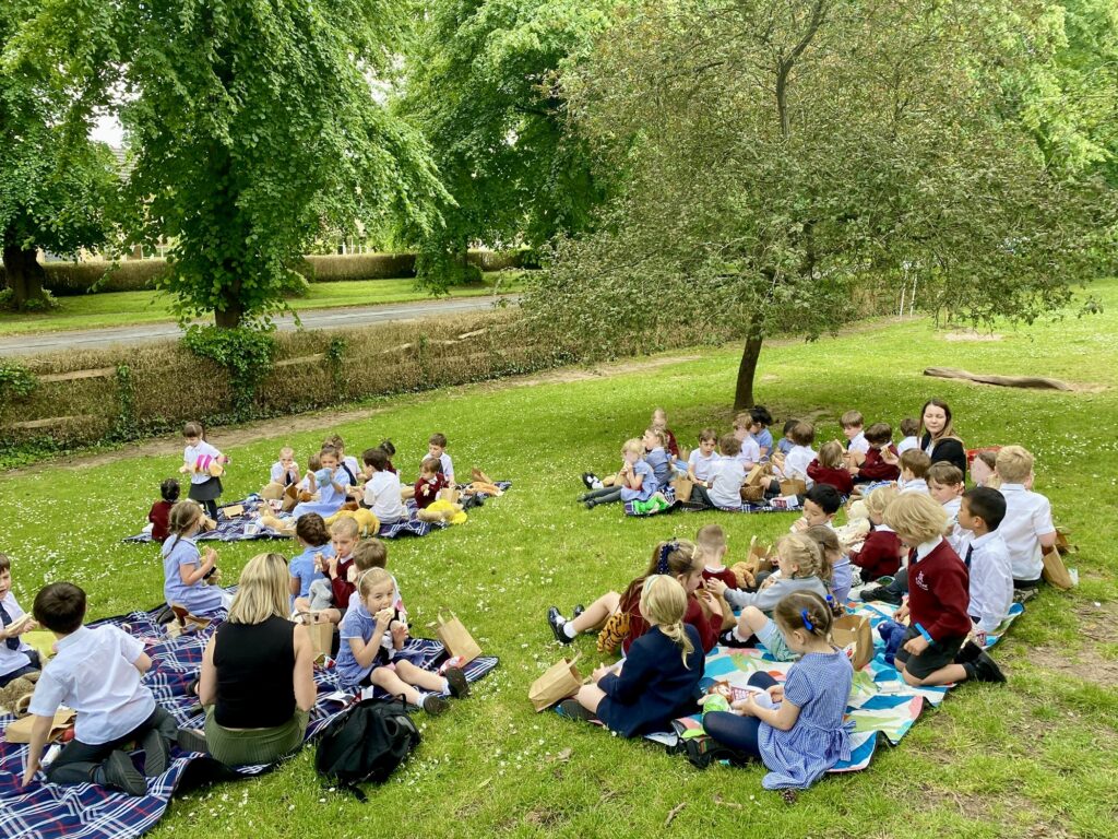 group of young students having a picnic