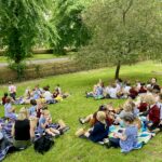 group of young students having a picnic