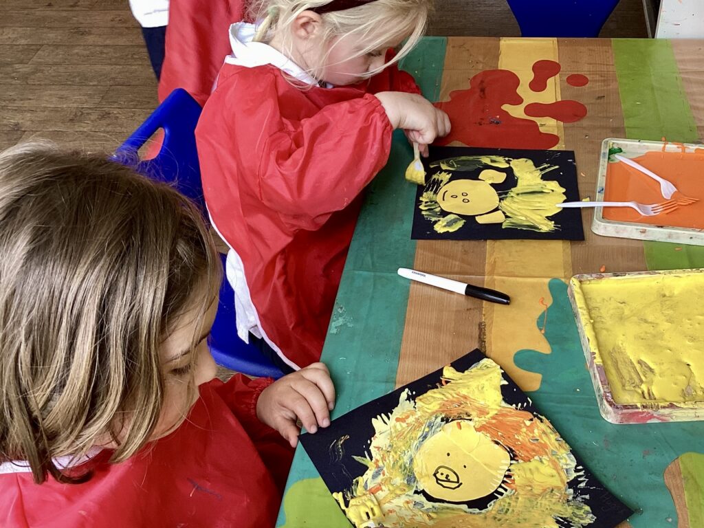 two pre-prep children doing artwork