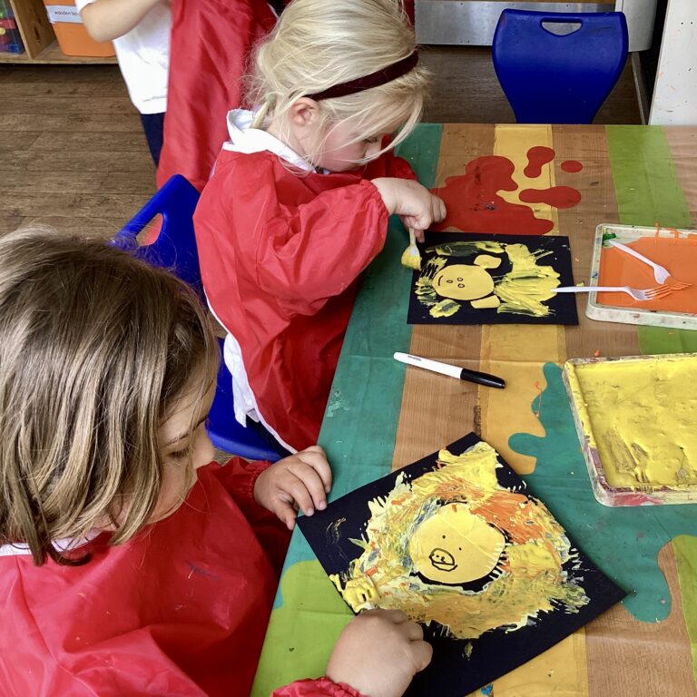 two pre-prep children doing artwork